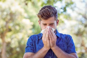 man suffering from allergies